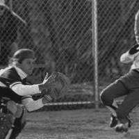 Grand Valley Softball player sliding into the base in a game.